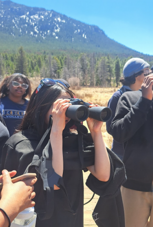 AXL 8th grade students learning to use binoculars